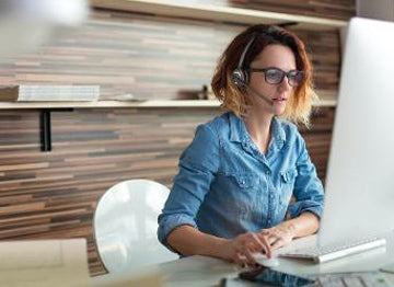 Woman using OfficAlly wireless office headset for call centers