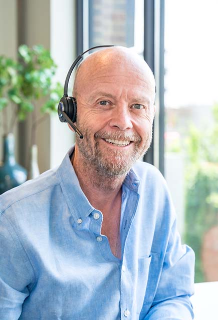 Mike Faith CEO Wearing an Office Headset