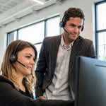 Workers training with Leitner LH670 Premium Plus wireless headset on computer - product thumbnail