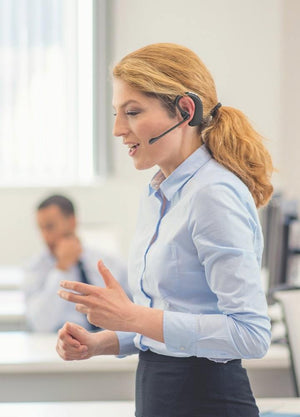 Business woman using OfficeAlly on-the-ear wireless headset- call center headsets, office headsets, telephone headset