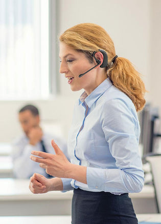 Woman enjoying the range of remote answering with Leitner LH280 on-the-ear headset